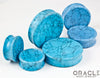 Synthetic Turquoise Concave Solid Double Flare Plugs