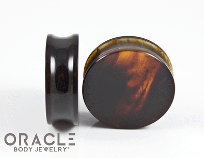 side wearable view of the dark amber plugs 