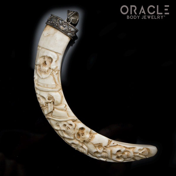 Boar's Tusk Pendant with Carved Skulls and Silver Filigree
